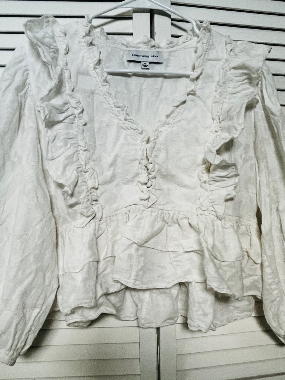 Something Navy Cream Ruffle V-Neck Peplum Blouse